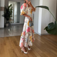 Tailliertes Kleid mit Karree-Ausschnitt, Blumenmuster und Puffärmeln