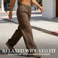 Damen-Jeans mit Leopardenmuster mit hoher Taille und weit been.